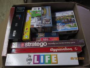 lot 93 image: box of puzzles and games...