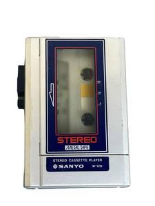 lot 30 image: Vintage Electronic Cassette Tape Recorders including Sanyo M-G10 Metal Cassette Player (Missing battery cover)Lloyds Model IV92A-114BRealtone 7609Hitachi Solid State TQP-200Soundesign 7638New Sealed Audio Cassette Recording Tapes