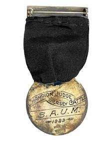 lot 77 image: RARE 1929 Sterling Silver Minnesota Jersey Cattle Club Medal (1.5 Diameter) Champion Judge Jersey Cattle S.A.U.M. - 35 Grams Total Weight