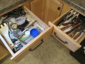 (2) drawers of assorted knives and ...