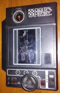 lot 32 image: Digital Derby Auto Raceway Handheld Game.