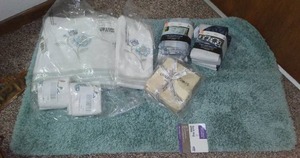 lot 86 image: NEW Bathroom Rug, Towel Set, Wash Clothes, Pillowcases.