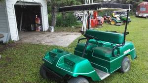 lot 404 image: American Continental Golf Cart. Great retro look. With gold upholstery it could be a Bison Buggy