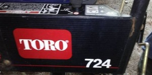 lot 426 image: Toro Snow Blower, Electric Start With Cab. running