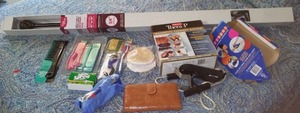 lot 93 image: Curtain Rod And Personal Hygiene Collection Wallet, Razors, Combs And More.