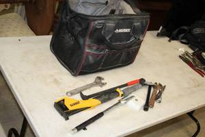 lot 25 image: Husky 16 Cordless Tool Bag with Hand Tools - DeWalt Stapler, Adjustable Wrenches, Ratchet, Wrenches, Pliers, Tape Measure, Misc. Tools