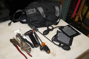 lot 26 image: 12 Tool Bag with Hand Tools - Locking Pliers, Ratchet, Screwdrivers, (2) Hand Pump Wedges