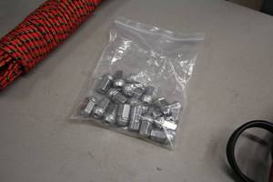 lot 34 image: Lot of (1 Bag  20) Automotive Lug Nuts with Wheel Lock (Acorn Style)