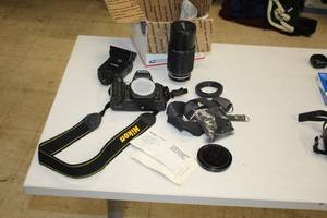 lot 57 image: Nikon N80 Camera with Accessories - Nikon Series E 70-200 14 Zoom Lens, Lens Covers, Acheiver 321AZ Computerized Electronic Photo Flash, Camera Strap