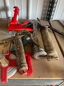 Caulking guns  Grease guns long tape measure