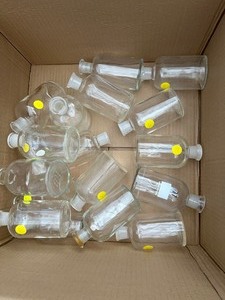 lot 100 image: Box of Assorted Used Wheaton Bottles 5 Inches Tall, Some have Chips