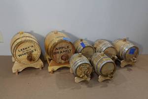 lot 127 image: 7 Mini Whiskey Barrels with Stands