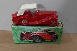 lot 168 image: Vintage Avon 1936 MG Tai Winds After Shave Bottle
