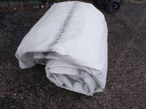 lot 55 image: Large Tarp may have holes or rips good for woodpile white