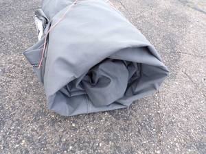 lot 56 image: Large Tarp may have holes or rips good for woodpile Gray