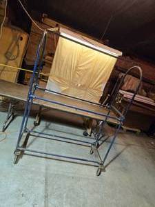 lot 26 image: Awesome Vintage Rolling Tire Rack