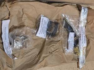 lot 173 image: Johnson JW-18R 3 HP Vintage Boat Motor Parts - Adjustment Clamp, Reverse Lock, Timing Lever