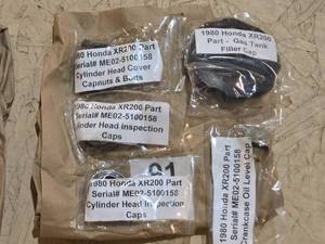 lot 267 image: 1980 Honda XR200 Motorcycle Parts Gas Tank Cap, Oil Dipstick, Head Inspection Caps, Cylinder Head Cover