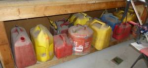 Entire shelf of 14 gas cans