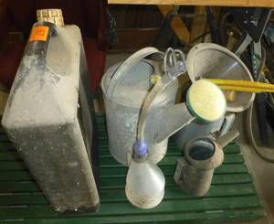 Group of oil pan, oil cans, watering can