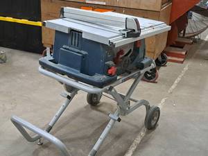 lot 31 image: Bosch Gravity Rise Folding Table Saw TS3000