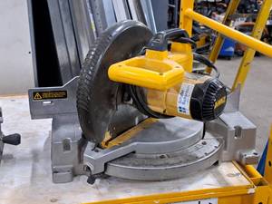 lot 83 image: DeWalt Compound Miter Saw DW703