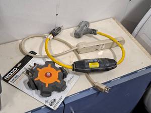lot 148 image: Lot of (3) Assorted Power Cord Accessories - Ridgid Multi-Outlet Hub, Surge Protectors