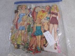 lot 130 image: (CNTR) Pack of Vintage Paper Dolls - 8 Dolls  58 Outfits