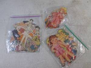 lot 131 image: (CNTR) 3 Smaller Packs Vintage Paper Dolls and Outfits