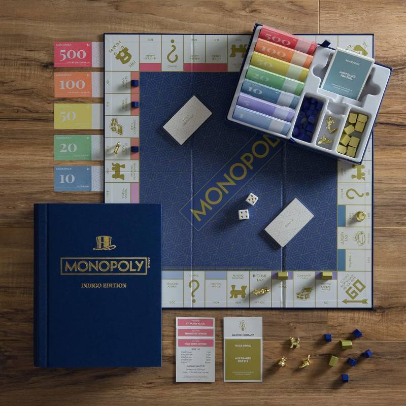 lot 182 image: NEW Indigo Collection 2-Pack Board Games Monopoly & Scrabble
