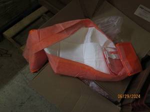case of orange disposable bed covers