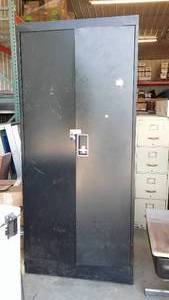 Metal 2 door Cabinet with shelves.
