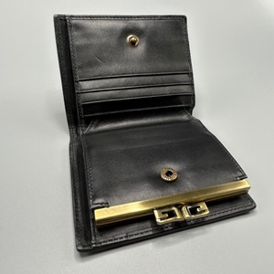 lot 34B image: Gucci Bifold Wallet Purse GG Canvas Kiss Lock, Black and Gold - Authentic