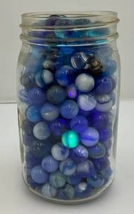 lot 25 image: Vintage Blue & White Swirl Marbles & More (Some Glow Under UV Light)