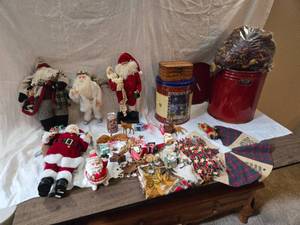 lot 234 image: Large Lot of Christmas Decor with Santa Clauses, Small Tree Skirt, Tin and more