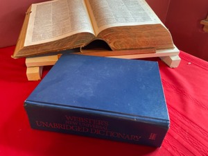lot 82 image: 1940 & 1989 Webster Dictionaries & Stand