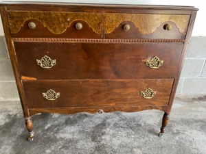 lot 35 image: Dark Wood Dresser on Wheels