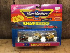 lot 131 image: Vintage Micro Machines Snap Backs #4 on Card