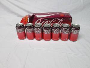 lot 172 image: 7 cans of Cherry Coke...