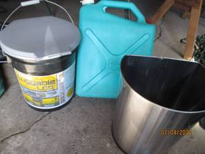 lot 23 image: Luggable Loo portable camping toilet, 6-gallon water jug and Trash can