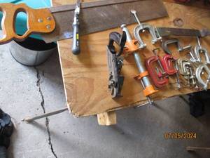 lot 62 image: Large assortment of c-clamps, hand saw, jab saw, manual planer and pipe clamp