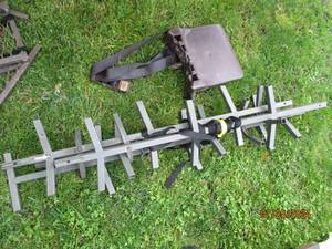 lot 65 image: Metal tree stand climbing ladder footings and plastic seat
