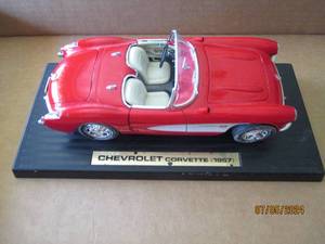 lot 17 image: Die-cast model 1957 Chevrolet Corvette replica car with movable parts