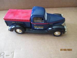 lot 84 image: Liberty Classics Die cast replica bank with key of 1940 Ford 5th Edition with Big Bear Family Centers advertisement