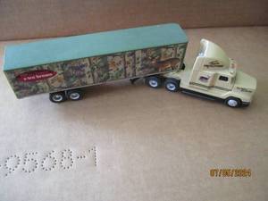 lot 89 image: Ertl Die cast semi replica with team RealTree advertisement