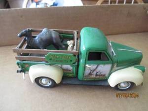 lot 97 image: Ertl Die cast replica of 1947 Studebaker with Deer Creek advertisement and removable animals
