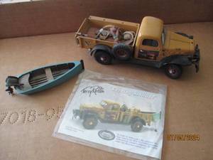 lot 101 image: Ertl Die cast replica of Dodge Powerwagon with Terry Redlin Evening Solitude with removable boat, fishing gear and dog