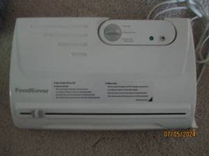 lot 109 image: Electric Food Saver Sealing machine...