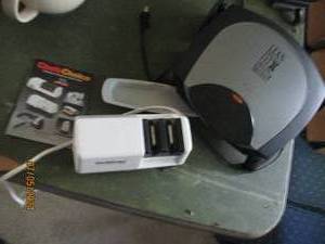 lot 113 image: George Foreman Lean Mean Fat Grilling Machine and an electric knife sharpener