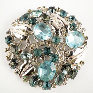Eye-catching, Aqua Blue Rhinestone Vine Round base Metal Brooch.